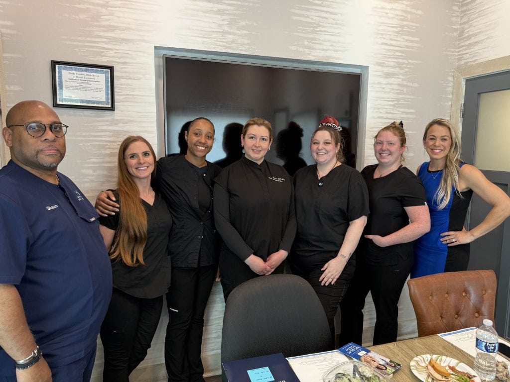 Professional healthcare team group photo at Full Pocket Coaching.