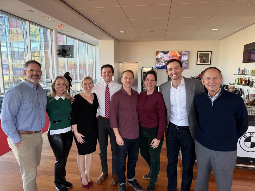 Full pocket coaching team group photo at event, professional networking, coaching team portrait, corporate team building, business coaching professionals.