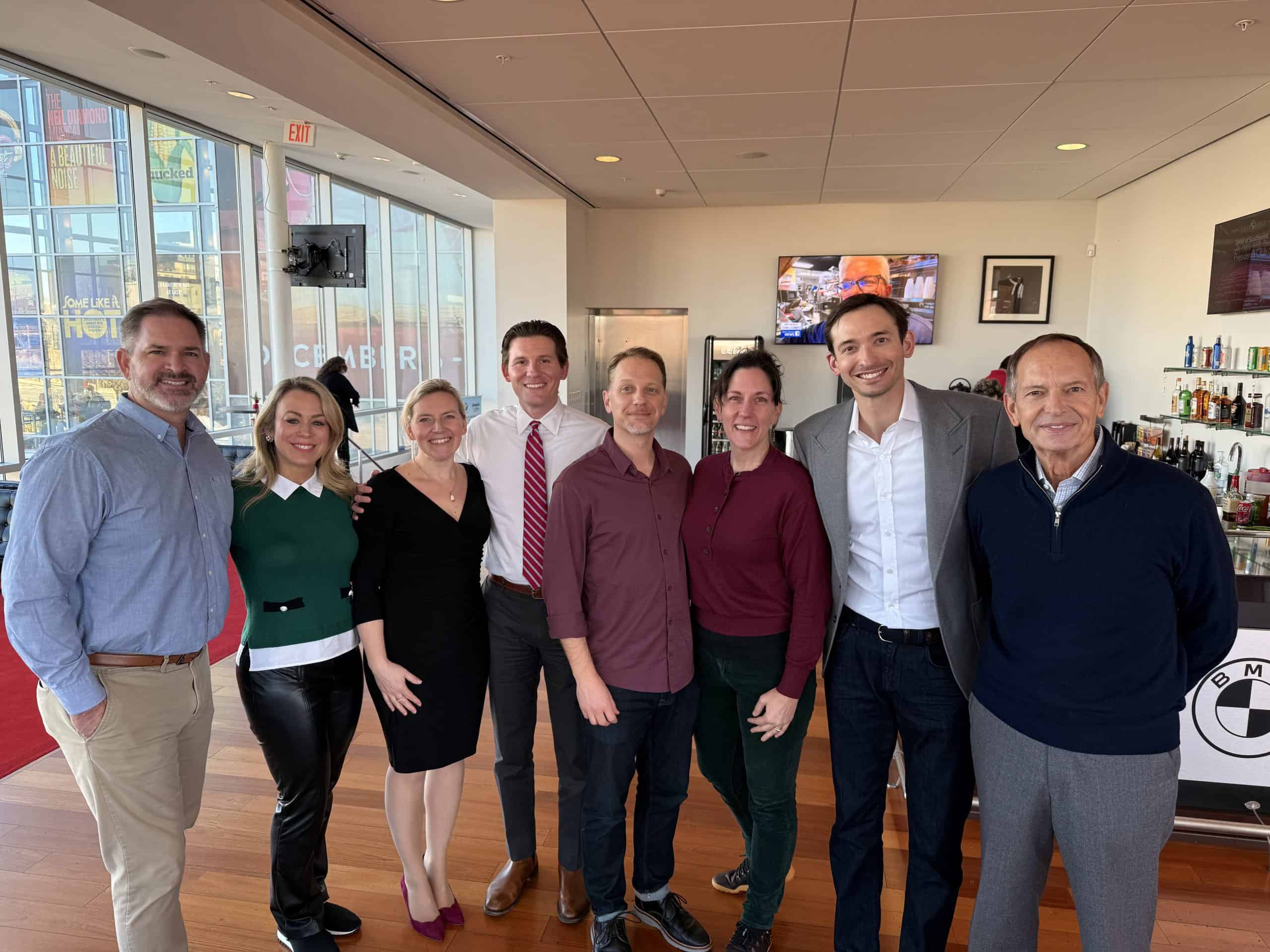 Full pocket coaching team group photo at event, professional networking, coaching team portrait, corporate team building, business coaching professionals.